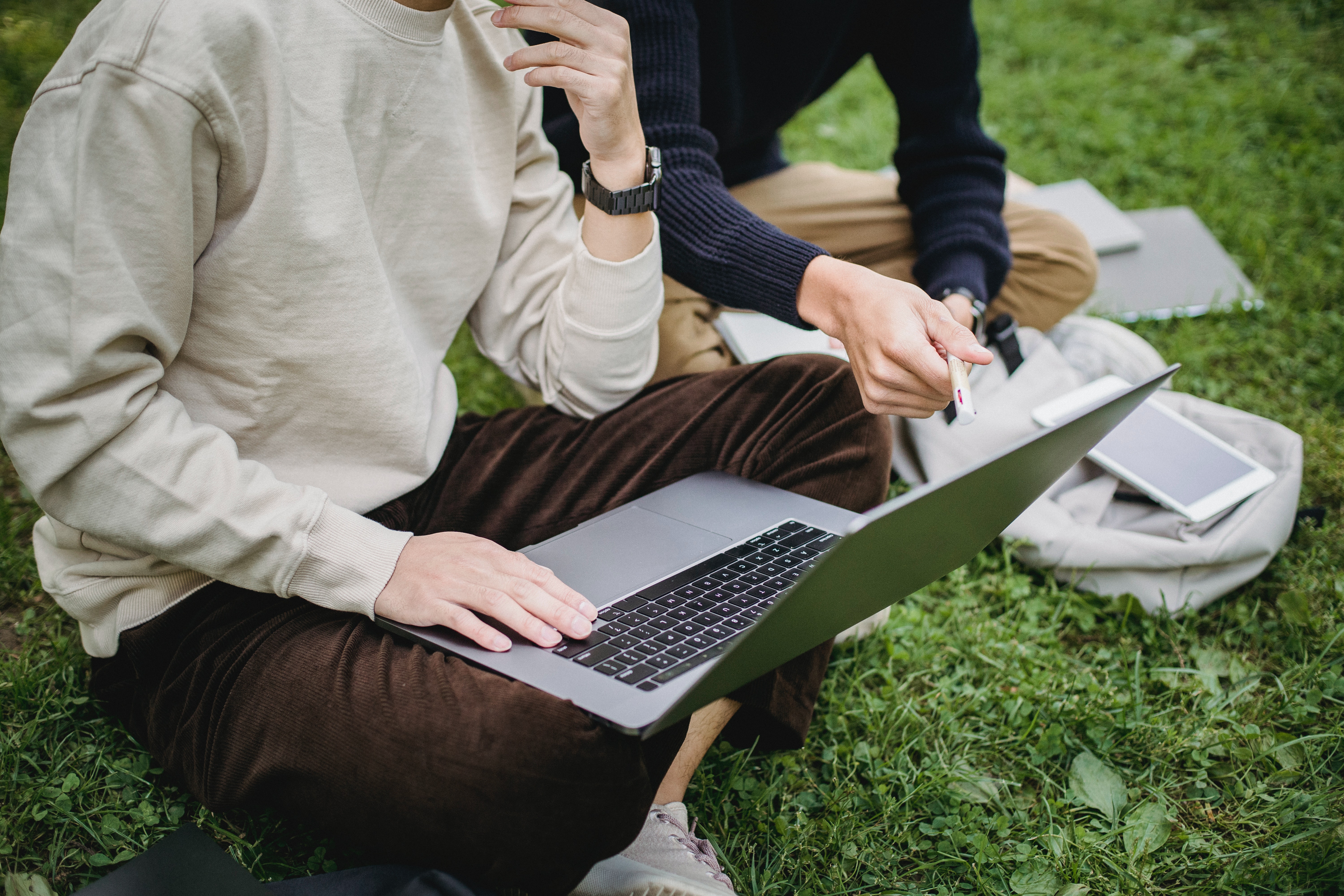Two young men looking at a PC screen